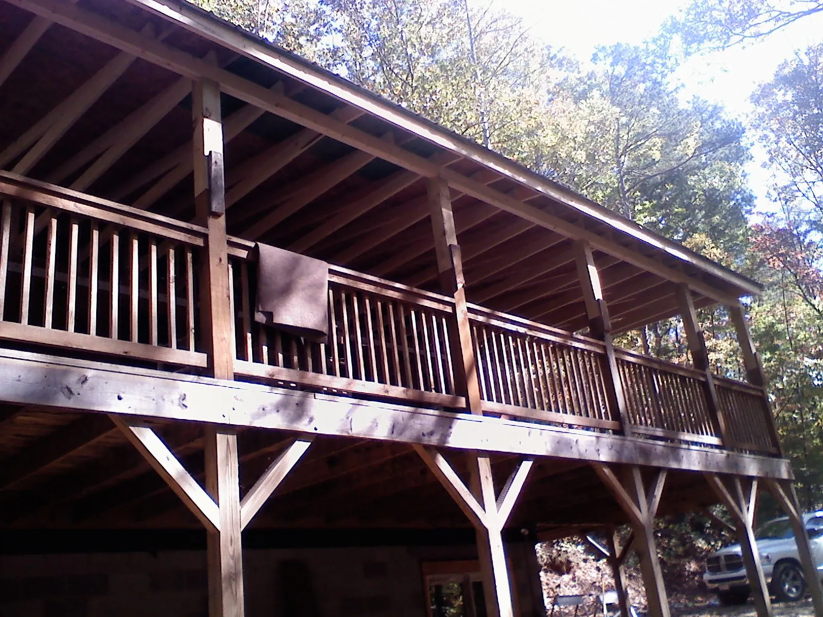 Timber framing under a new elevated porch and deck — Roof Leak Repair in East Aurora by Roofing Brothers